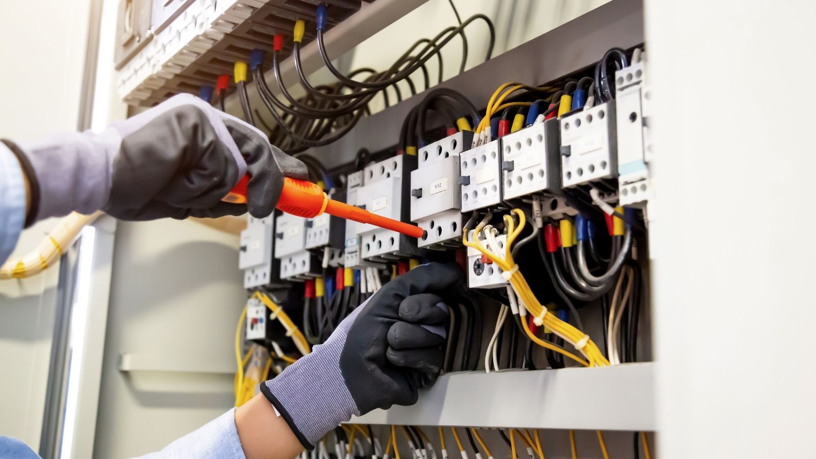 Electrician repairing electrical panel Electrician repairing electrical panel